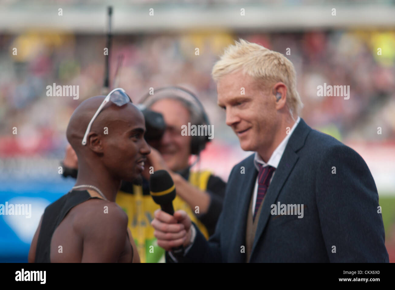 Mo Farah of Great Britain being interviewed after winning the 2 mile race at the Diamond League Athletics meeting in the Alexander Stadium, Birmingham, 2012 Stock Photo