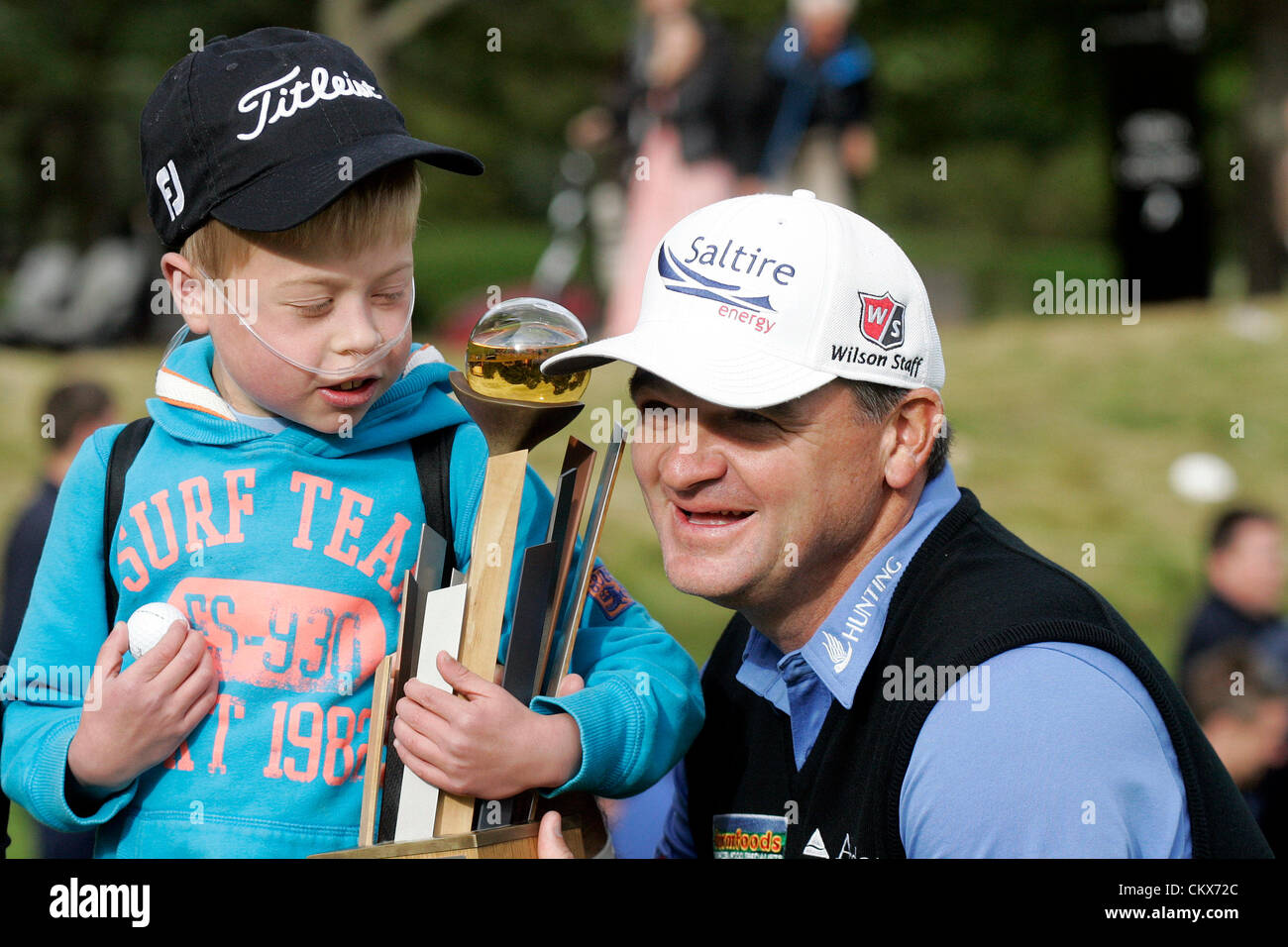 26th Aug 2012. Gleneagles, Scotland. Paul Lawrie with a young fan