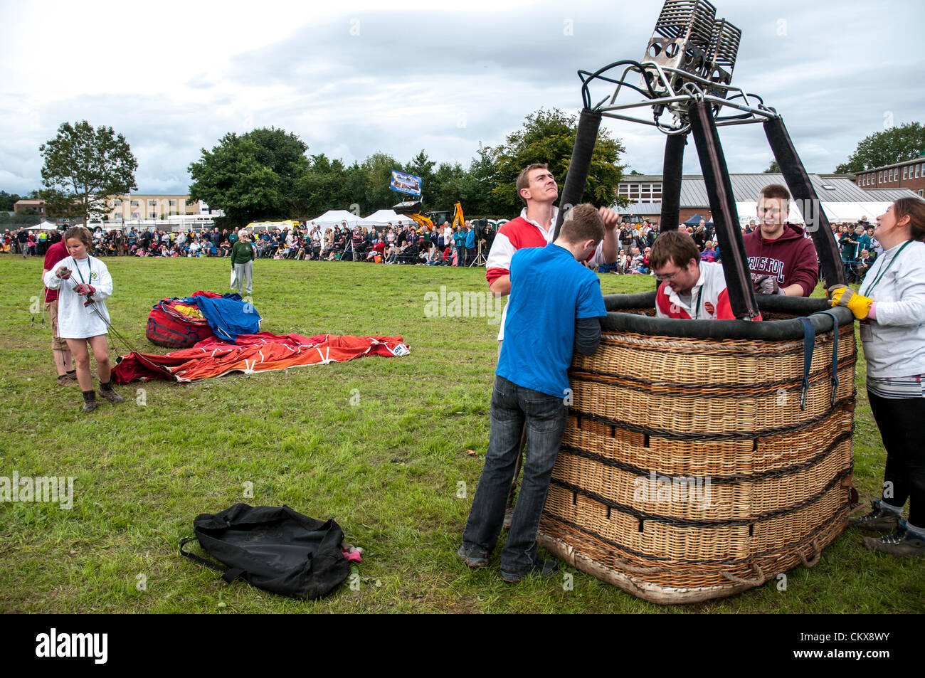 26th Aug 2012. The John Harris (G-CDWD) University of Bristol balloon is prepared for launch at the Tiverton balloon festival in Tiverton, Devon, UK. Stock Photo