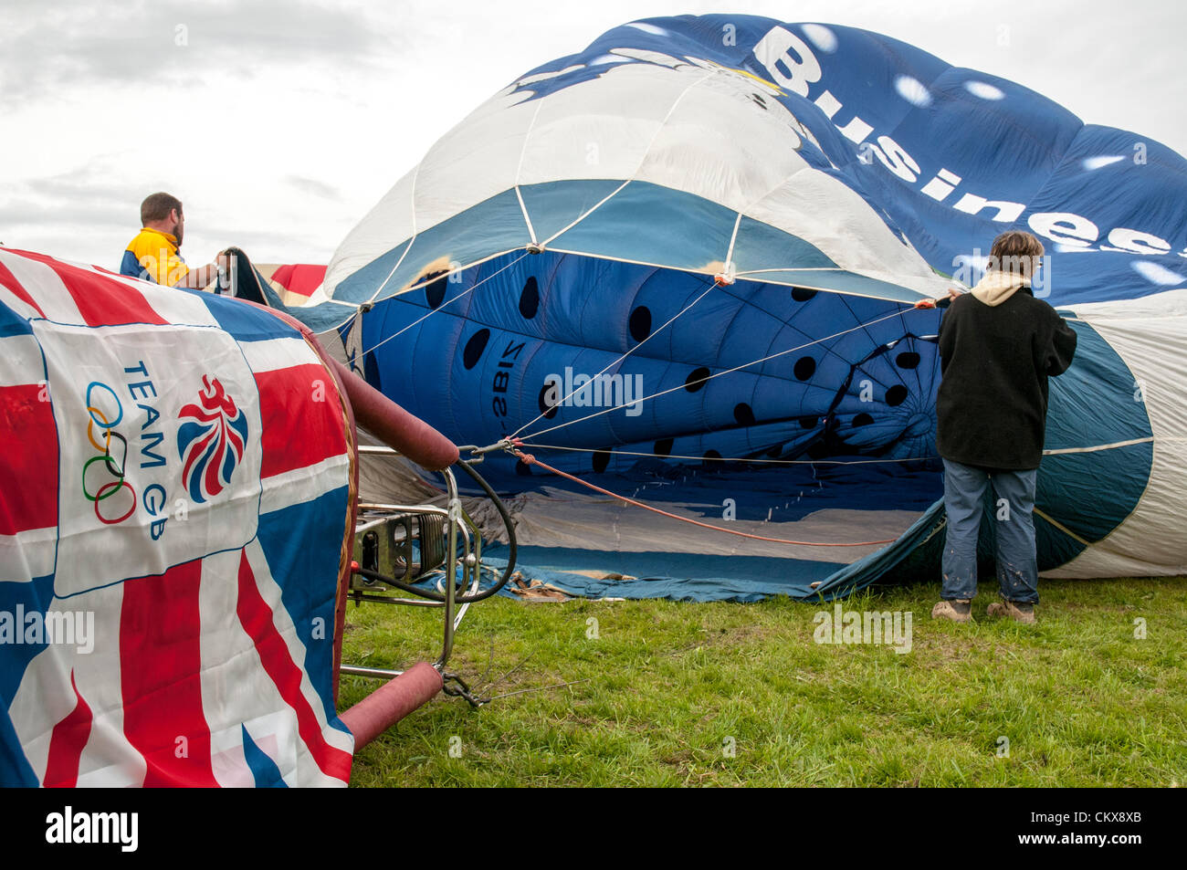 26th Aug 2012. G-SBIZ Cameron Z.90 Snow Business Hot Air Free Balloon is prepared for launch at the Tiverton balloon festival in Tiverton, Devon, UK. Stock Photo