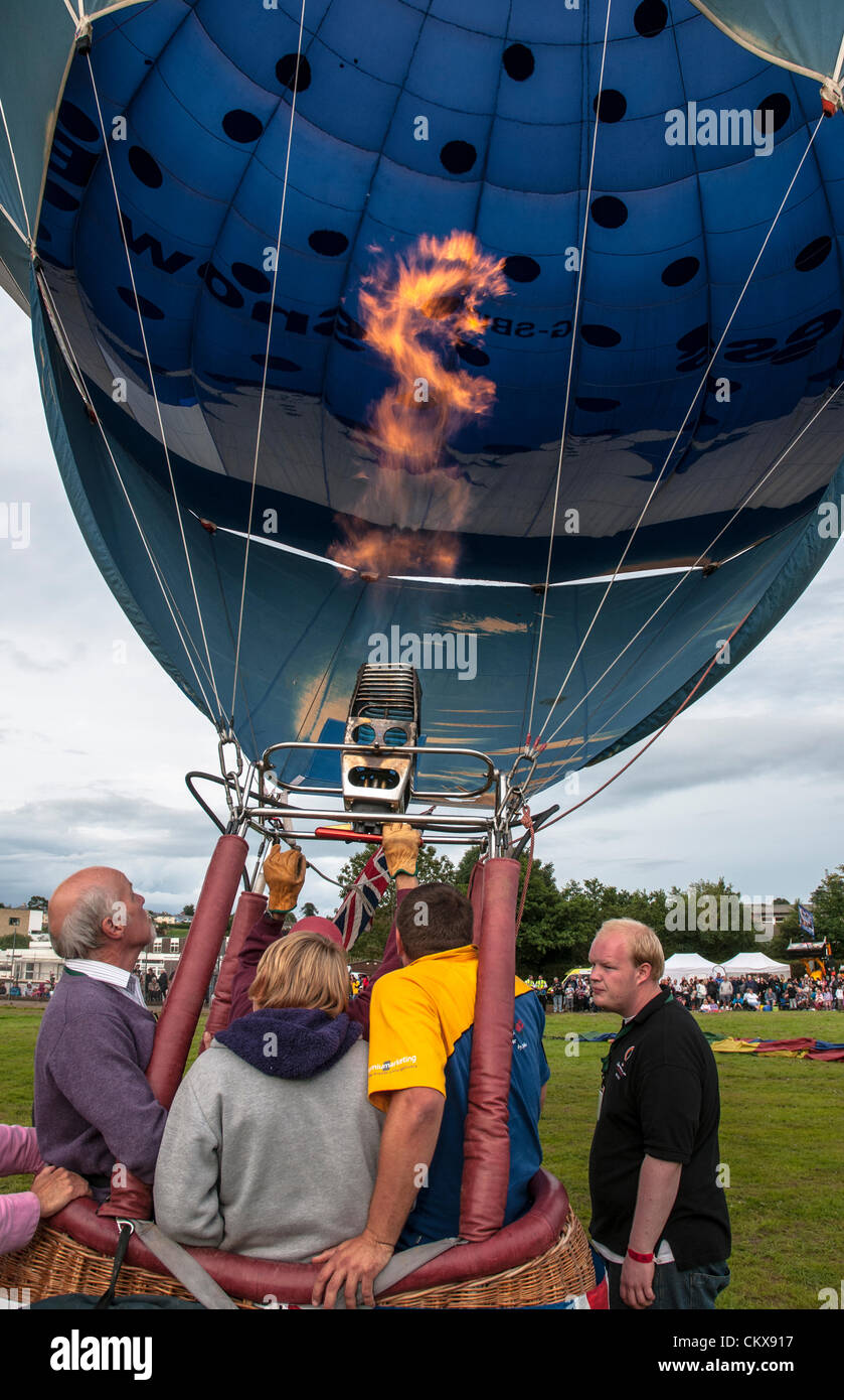 26th Aug 2012. G-SBIZ Cameron Z.90 Snow Business Hot Air Free Balloon is prepared for launch at the Tiverton balloon festival in Tiverton, Devon, UK. Stock Photo