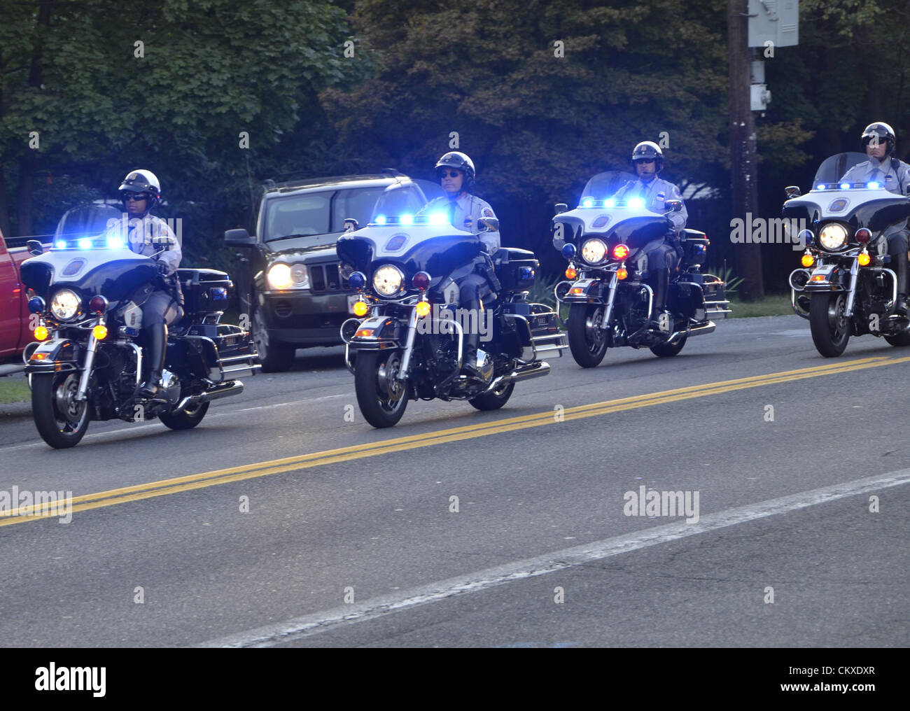 Police escort the relatives to lattend a viewing  held forPrine George's County  Police Officer Adrian A. Morris  at Borgwardt's Funeral Home, located at 4400 Powder Mill Road in Beltsville.He was killed when he lost control of his cruiser chasing a thief    Photo By Tom Carter Alamy Live News Stock Photo