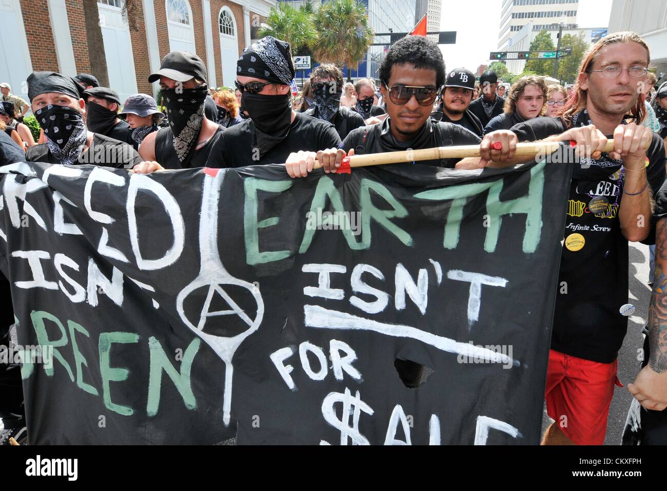 Tampa, Florida, USA. 28th Aug 2012. Black Bloc Protestors march through the streets against the Westboro Baptist Church during the Republican National Convention. Hundreds of protestors  marched through the streets of Tampa against the views of the controversial religious group. (Photo/Chris Post). Credit:  Over X Photography / Alamy Live News Stock Photo