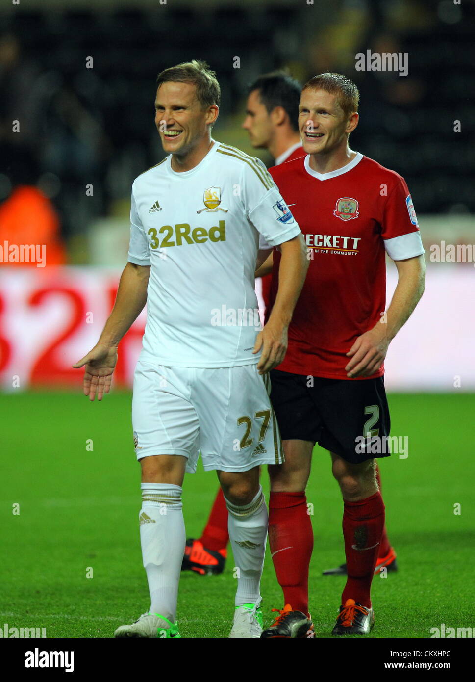Pictured L-R: Mark Gower of Swansea and Bobby Hassell of Barnsley. Tuesday 28 August 2012  Re: Capital One Cup game, Swansea City FC v Barnsley at the Liberty Stadium, south Wales. Stock Photo