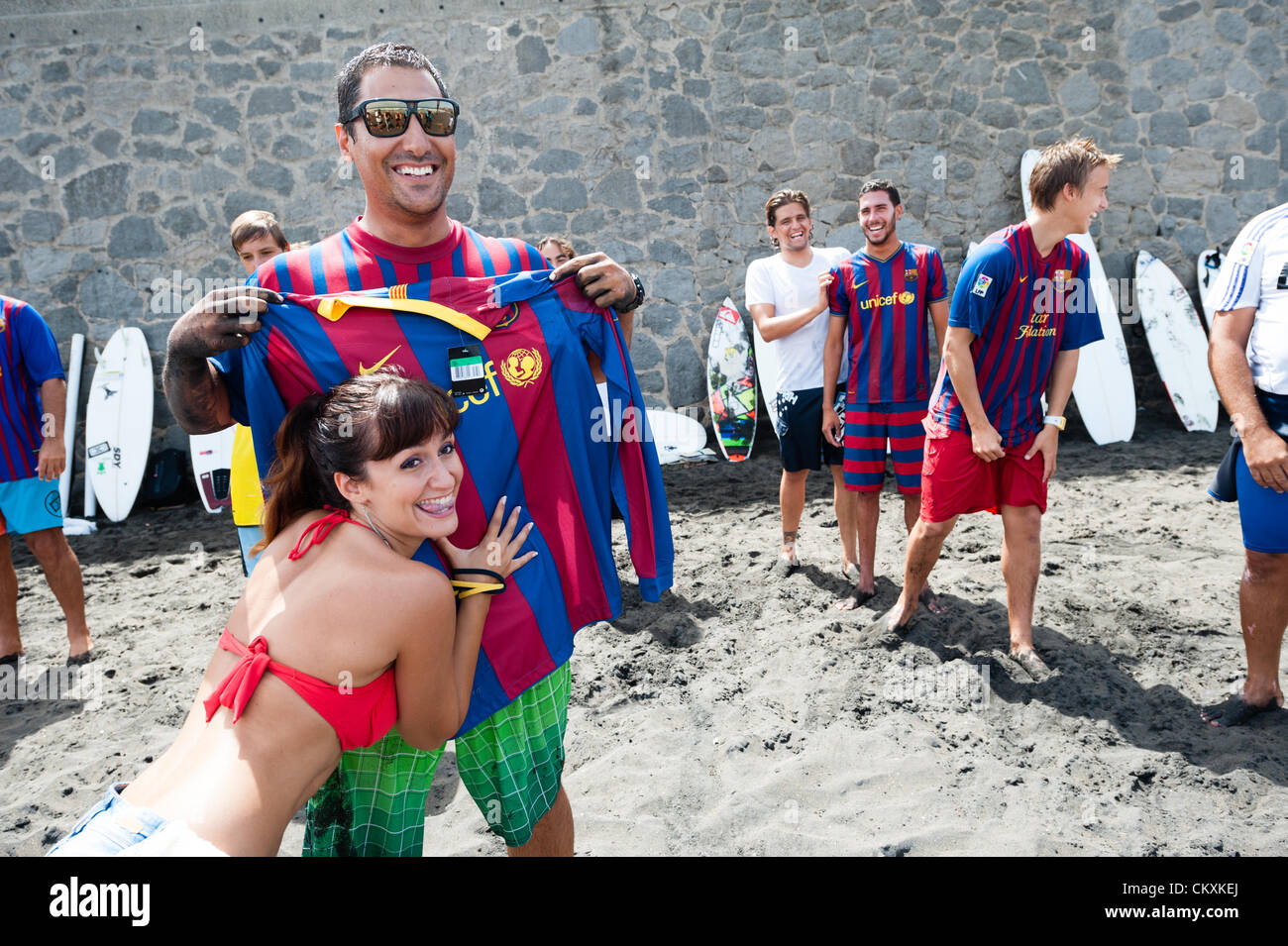LAS PALMAS, CANARIAS ISLANDS, SPAIN–AUGUST 29, 2012: Unidentified young  surfers from University Surf School and Surf Camp Las Palmas during an  informal competition, formed as an football match with 11 surfers in