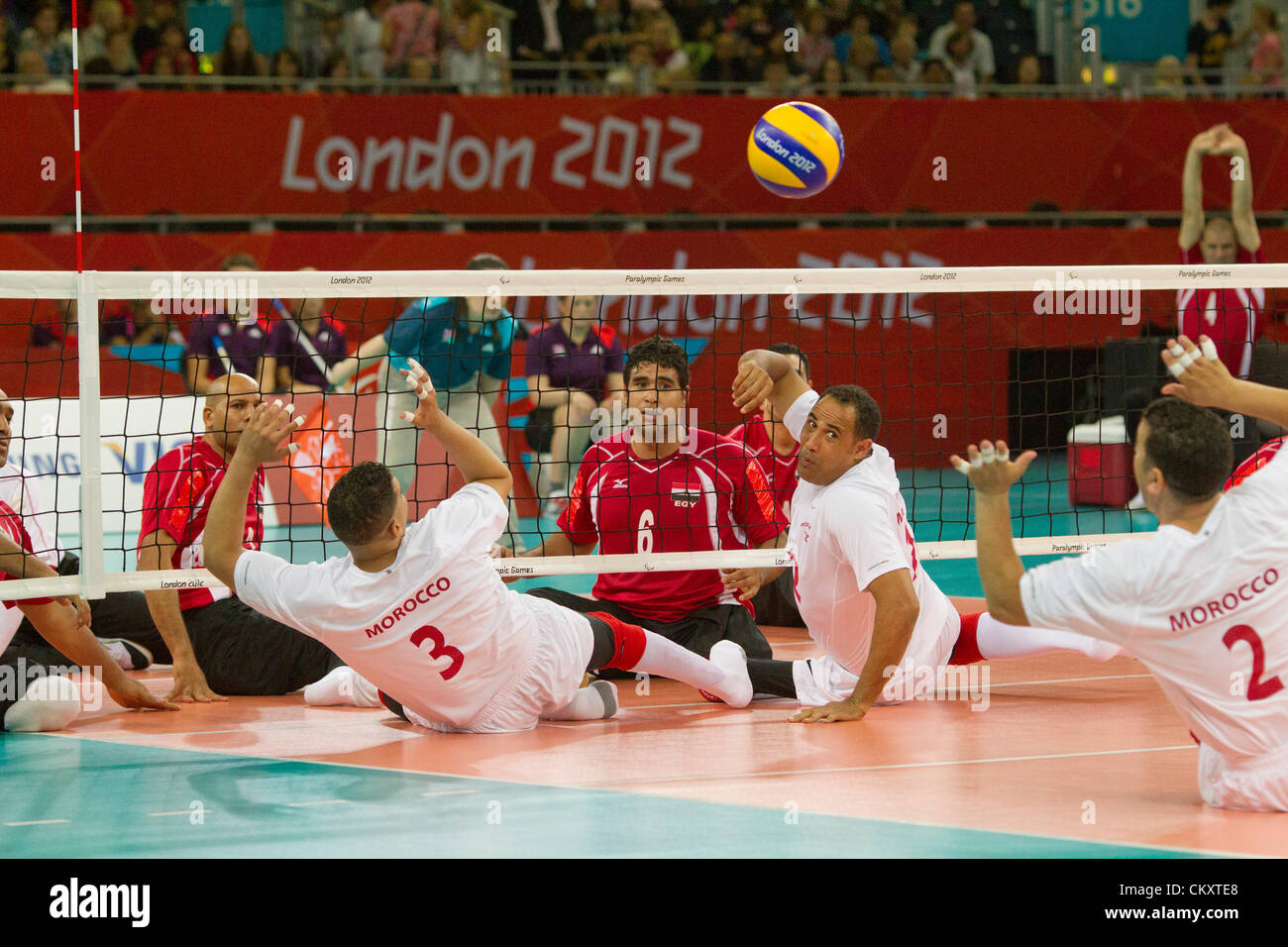 Men's sitting volleyball game between Morocco (white) and Egypt (red