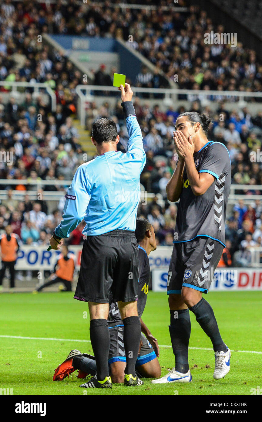 Newcastle, England. 30th Aug 2012. Marinaldo Da Silva is given a yellow card Referee Mr S. Studer during the Europa League Qualifying 2nd leg tie between Newcastle United and Atromitos from St James Park. Stock Photo