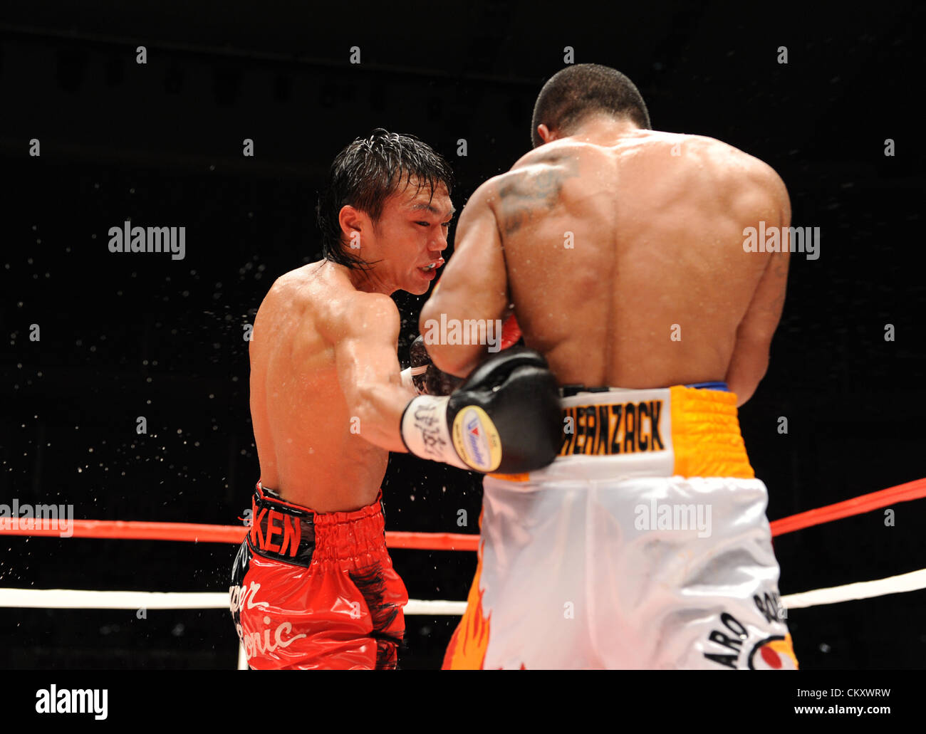 (L-R) Toshiyuki Igarashi (JPN), Sonny Boy Jaro (PHI), JULY 16, 2012 - Boxing : Toshiyuki Igarashi of Japan hits Sonny Boy Jaro of Philippines during the WBC flyweight title bout at Wing Hat Kasukabe in Saitama, Japan. (Photo by Mikio Nakai/AFLO) Stock Photo