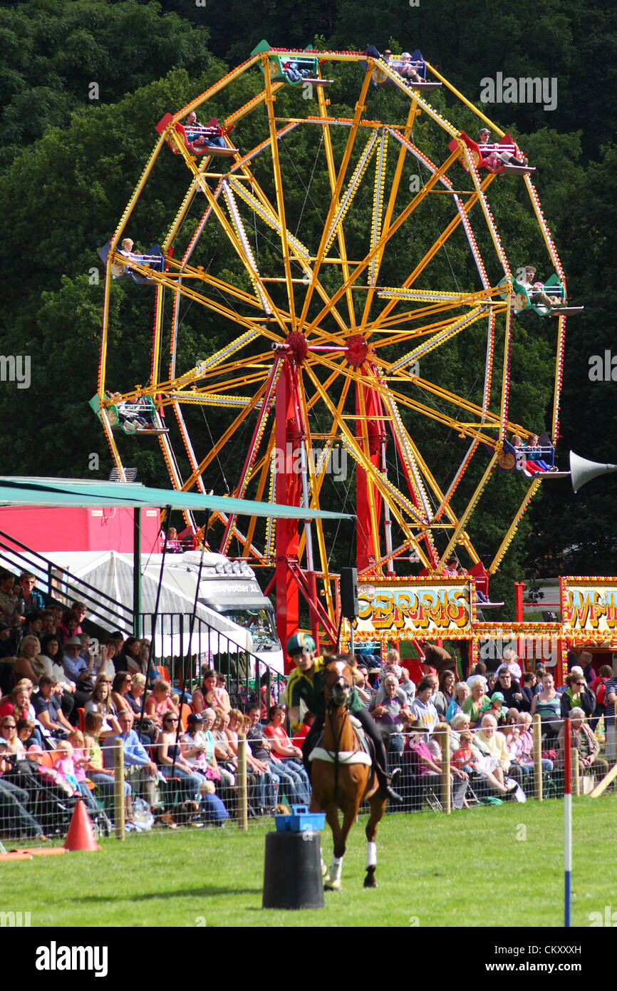 Horse show below the Big Wheel at the vintage funfair in the grounds of Chatsworth House during Chatsworth Country Fair, Peak District, Derbyshire, UK Stock Photo