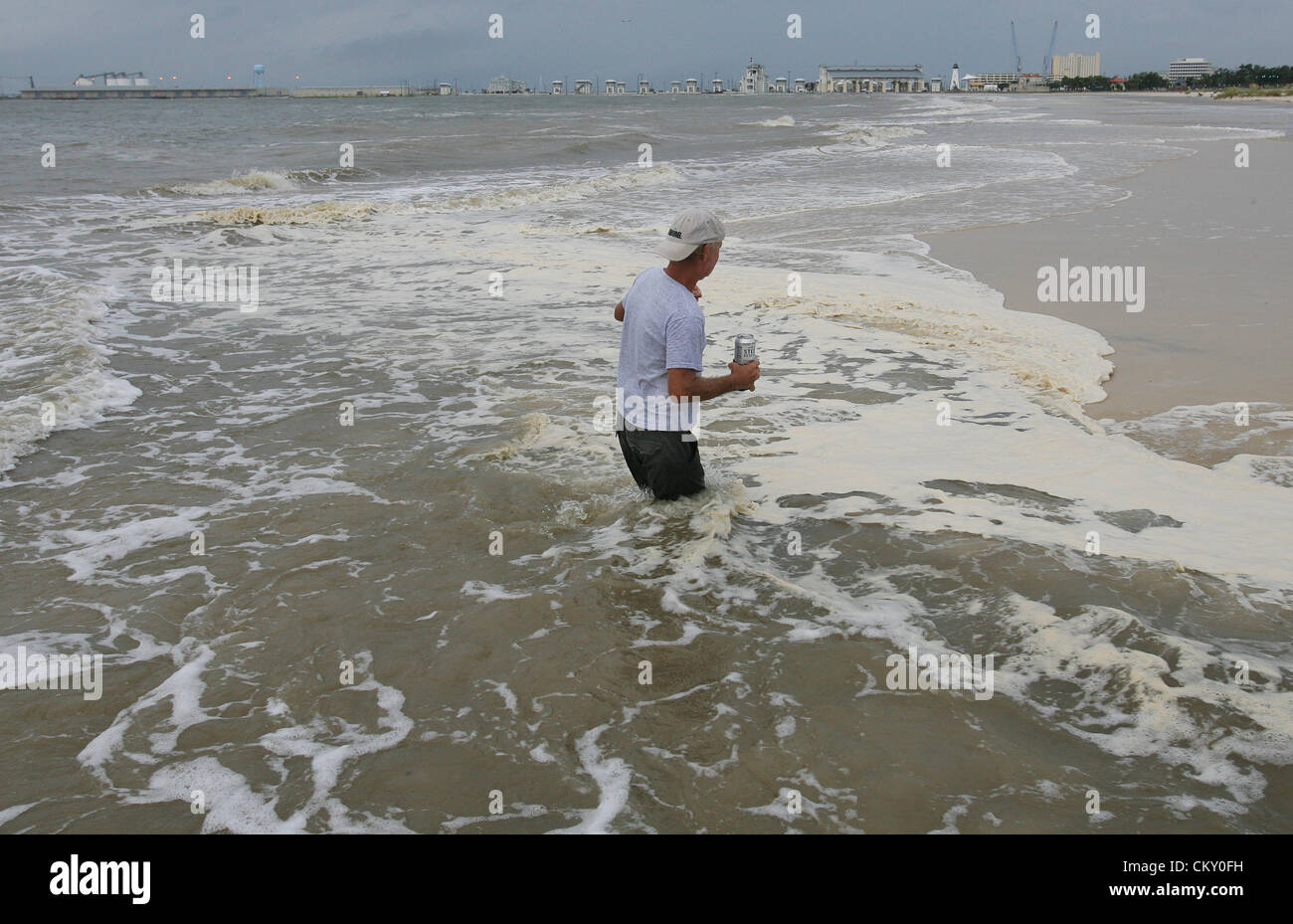Aug. 28, 2012 - Gulfport, MISSISSIPPI, USA - Storm clouds from Hurricane Isaac come in as Paul MacNeil walks the beach in Gulfport, Mississippi, USA on August 28, 2012. Hurricane Isaac will make landfall as a Category 1 Hurricane. (Credit Image: © Dan Anderson/ZUMAPRESS.com) Stock Photo