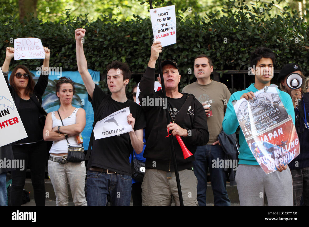 Protesting against Japanese dolphin slaughter - London. Around 50 people gathered outside the Japanese embassy in London today (31.8.12) to protest against the slaughter of dolphins and small whales in Japan. The peaceful protest fights against the start of the annual Taiji dolphin cull as seen in the documentary The Cove which takes place on September 1st. Stock Photo