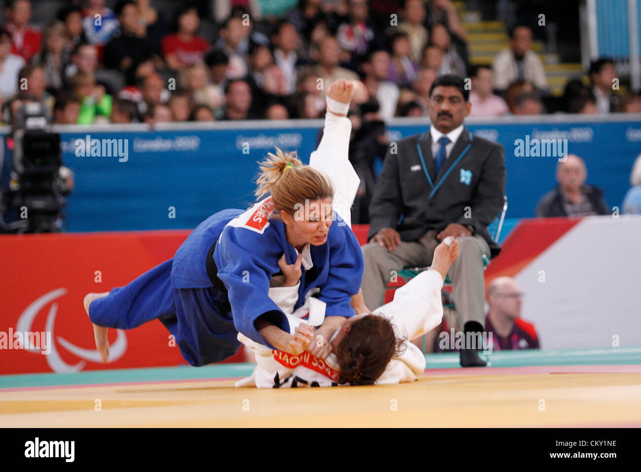 31.08.2012. London, England, 2012 Paralympic Games.   judo  bronze medal action. u63 kilo Daniele Bernardes Milan (BRA) blue throws Naomi Soazo (VEN) for ippon to win bronze medal. Stock Photo