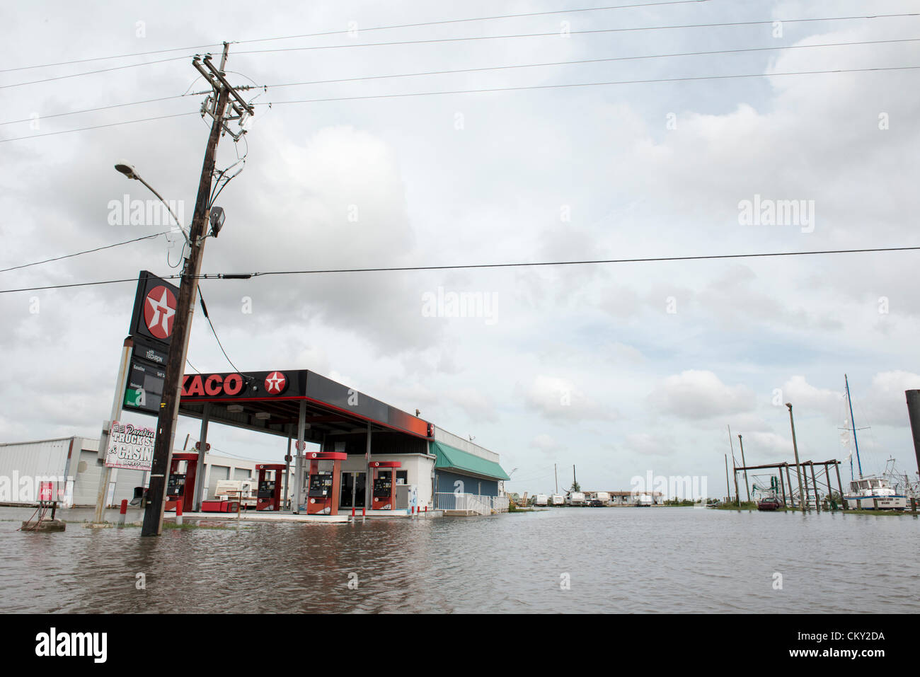 Floodwaters remain on Friday, August 31 2012 in New Orleans suburbs following Hurricane Isaac's hovering rainfall. Daily high tides have created a continuing surge of floodwaters into unexpected areas. Many blame the Corps of Engineers for diverting floodwater overflow into the suburbs during the restructuring of New Orleans flood control system following Hurricane Katrina. Stock Photo
