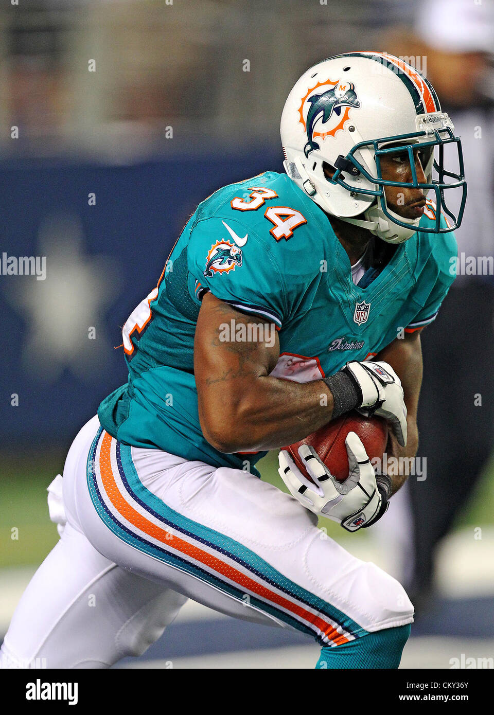 Aug. 29, 2012 - Arlington, Texas, United States of America - Miami Dolphins running back Marcus Thigpen (34) in action during the pre- season game between the Miami Dolphins and the Dallas Cowboys at the Cowboys Stadium in Arlington, Texas. Dallas defeats  Miami 30 to 13. (Credit Image: © Dan Wozniak/ZUMAPRESS.com) Stock Photo