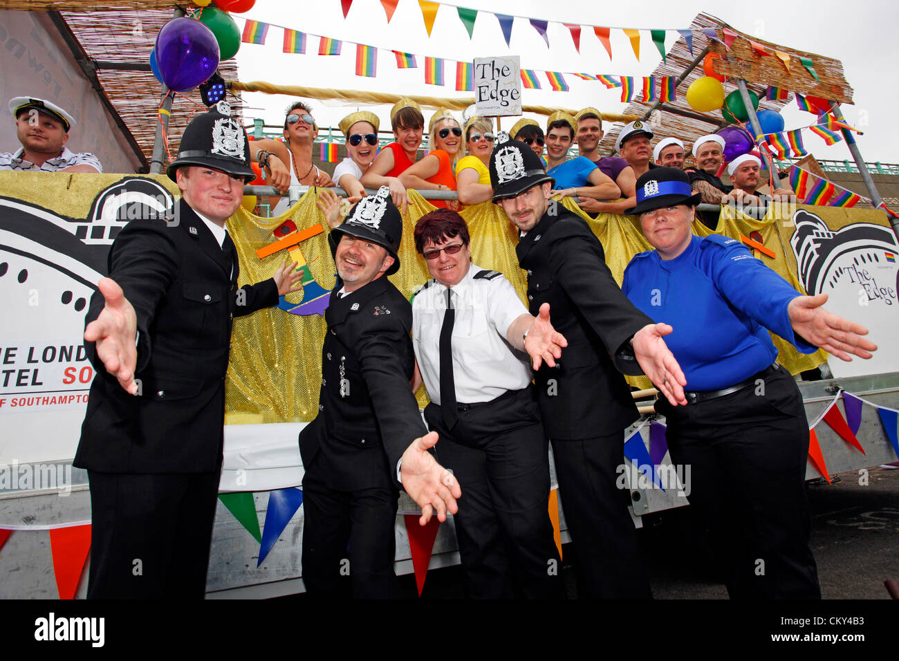 Brighton, UK. 1st September 2012. Police with marchers in the Brighton Gay Pride Parade 2012 in Brighton, England Stock Photo