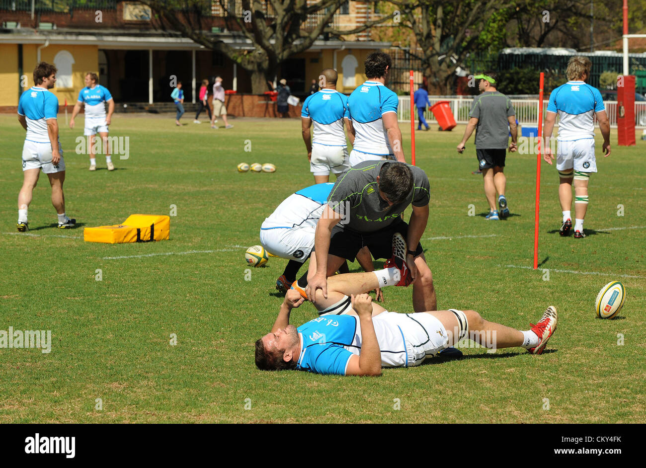 JOHANNESBURG, SOUTH AFRICA - SEPTEMBER 01, Flip van der Merwe getting stretched during the South African national rugby team field session and media conference at KES on September 01, 2012 in Johannesburg, South Africa Photo by Duif du Toit / Gallo Images Stock Photo