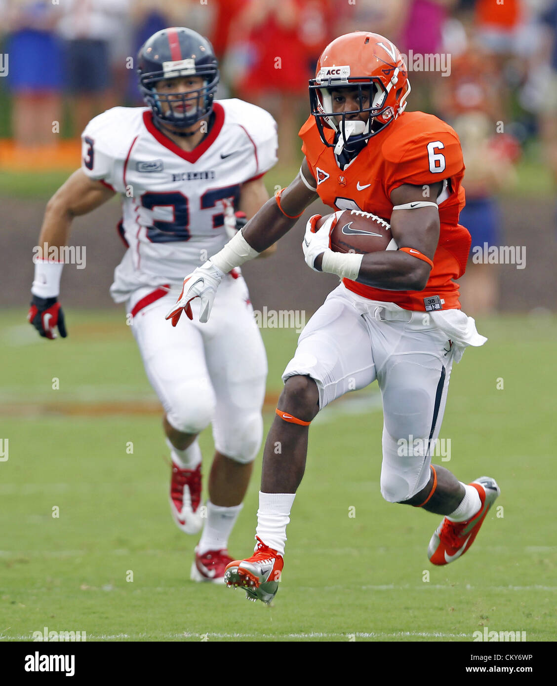 Sept. 1, 2012 - Charlottesville, Virginia, UNITED STATES - Virginia Cavaliers wide receiver Darius Jennings (6) runs a ctach in for a touchdown in front of Richmond Spiders defensive back Doug Howell (33) during the first half of the NCAA football game Saturday September, 1, 2012 at Scott Stadium in Charlottesville, Va. (Credit Image: © Andrew Shurtleff/ZUMAPRESS.com) Stock Photo