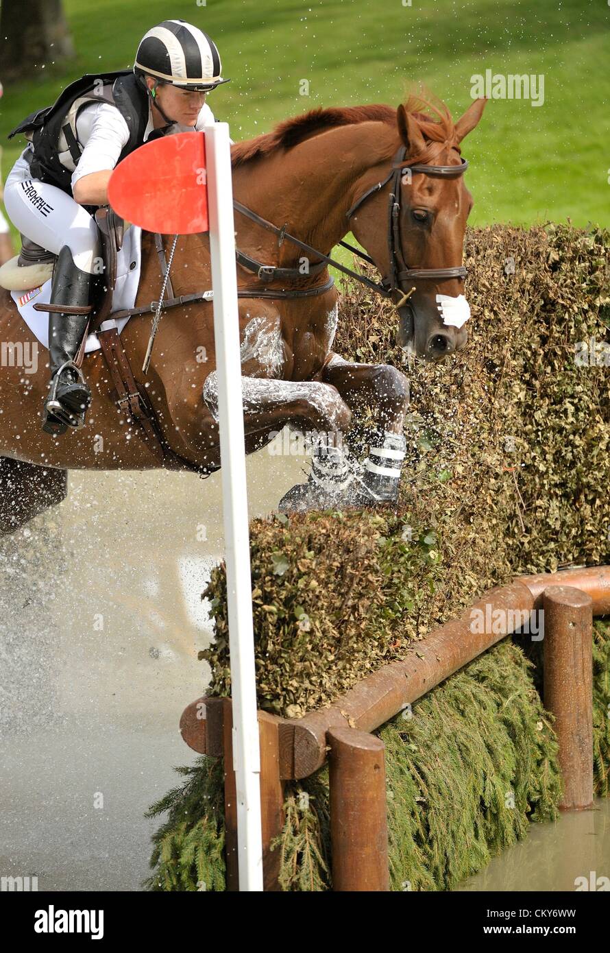 01.09.2012 Burghley House Stamford, England.  Overnight leader Sinead Halpin (USA) riding MANOIR DE CARNEVILLE in action at the Land Rover Trout Hatchery during the cross country phase on day three of The Land Rover Burghley Horse Trials. Sinead takes her score of [36.3] into the final day. Stock Photo