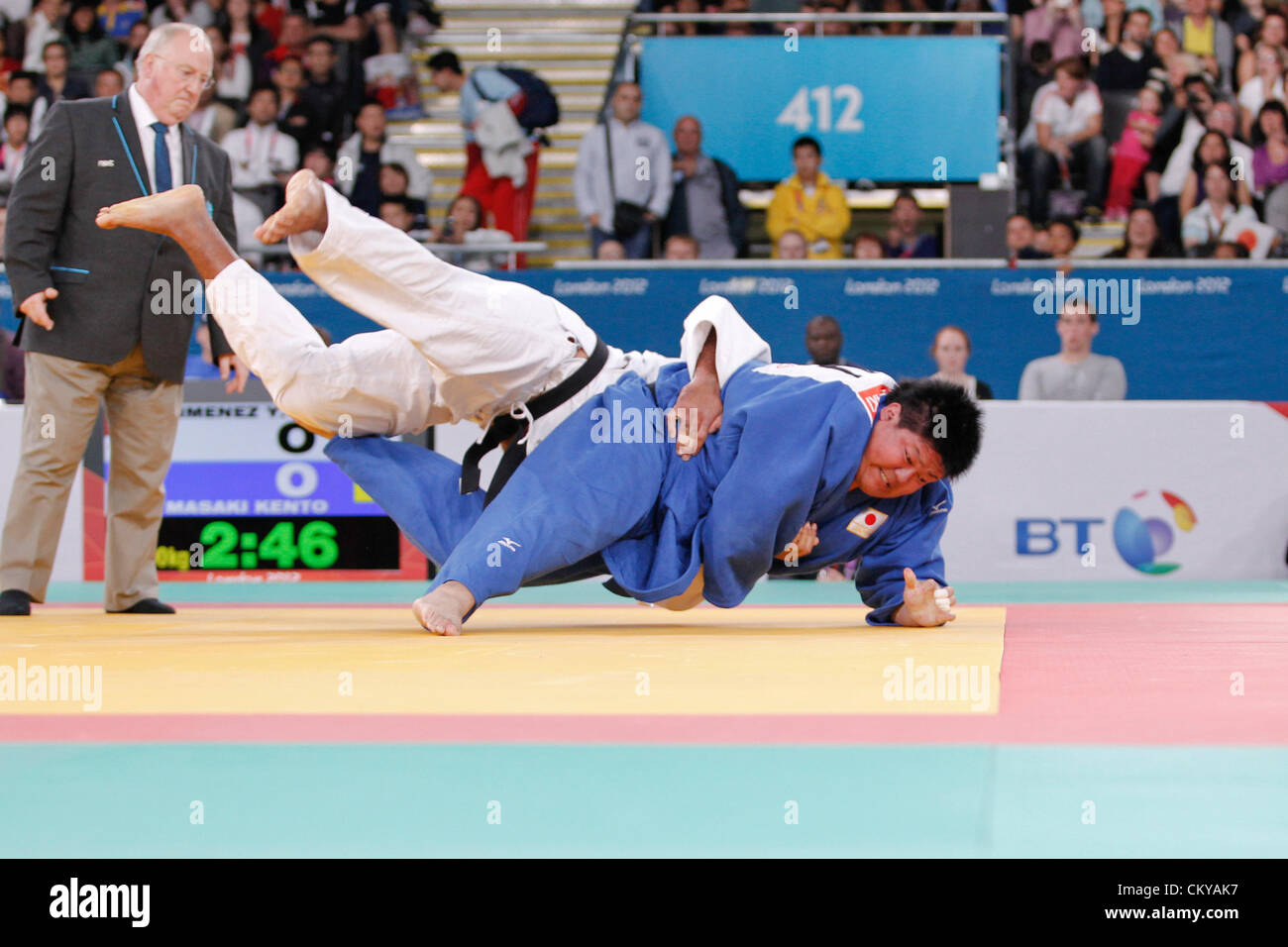 02.09.2012. London England.   judo semifinal action. +100 kilo Kento Maska (JPN) blue, throws Yangaliny Jimenez Dominguez (CUB) for ippon winning throw. Stock Photo