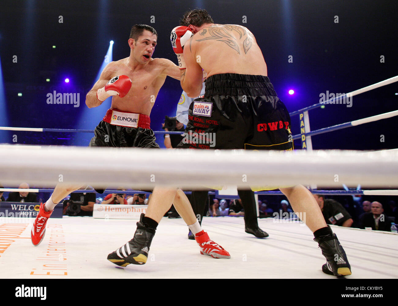 01.02.2012. Oberhausen, Germany.  German boxer and WBA middleweight world champion Felix Sturm (R) and Australian boxer and IBF world champion Daniel Geale box at Koenig Pilsener Arena in Oberhausen, Germany, 01 September 2012. Sturm lost the title unification fight on points. Stock Photo