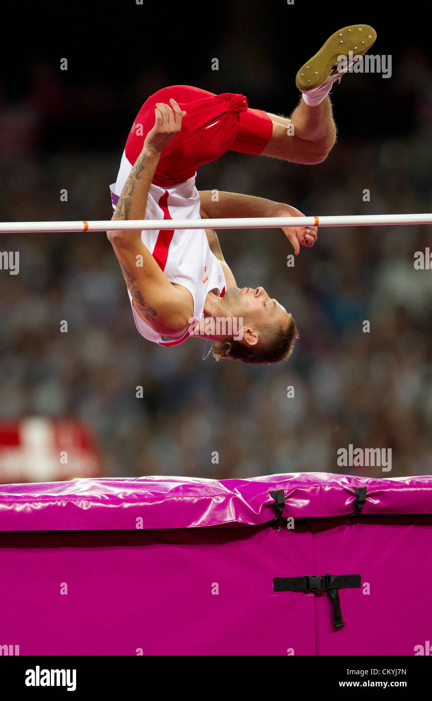 Poland's Lukasz Mamczarz heads over the high jump bar in the men's high jump F42 class at Olympic Stadium in London. Stock Photo