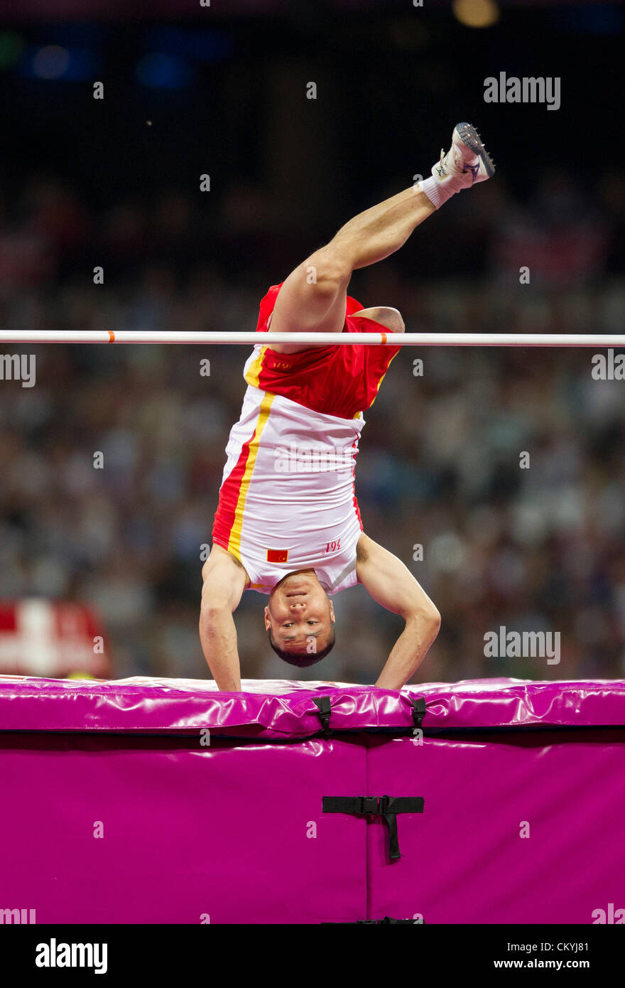 China's Weizhong Guo flips over the bar in the men's F42 high jump at the London Paralympics. Stock Photo