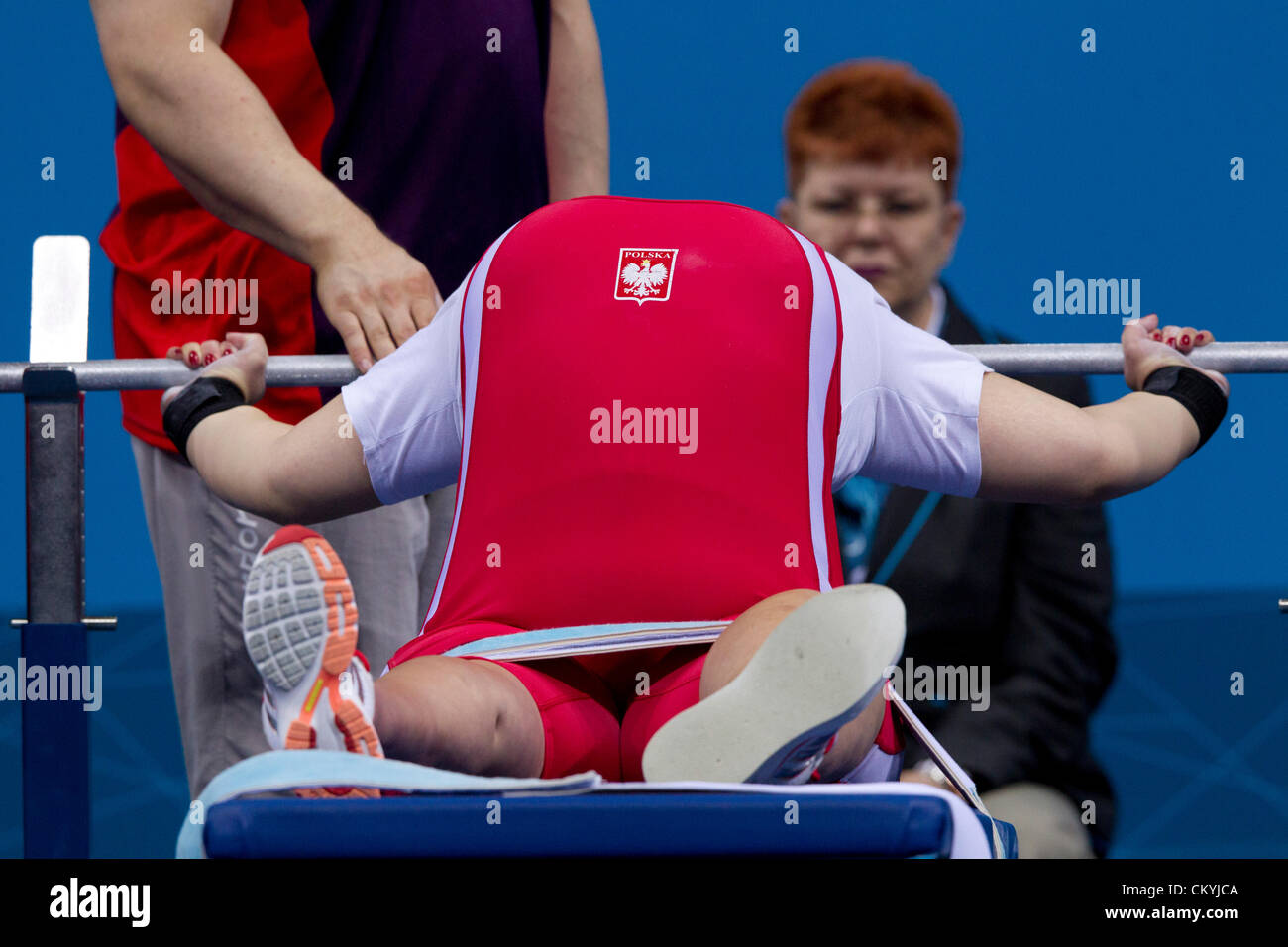 Poland's Marzona Lazara puffs out her chest before lifting n the women