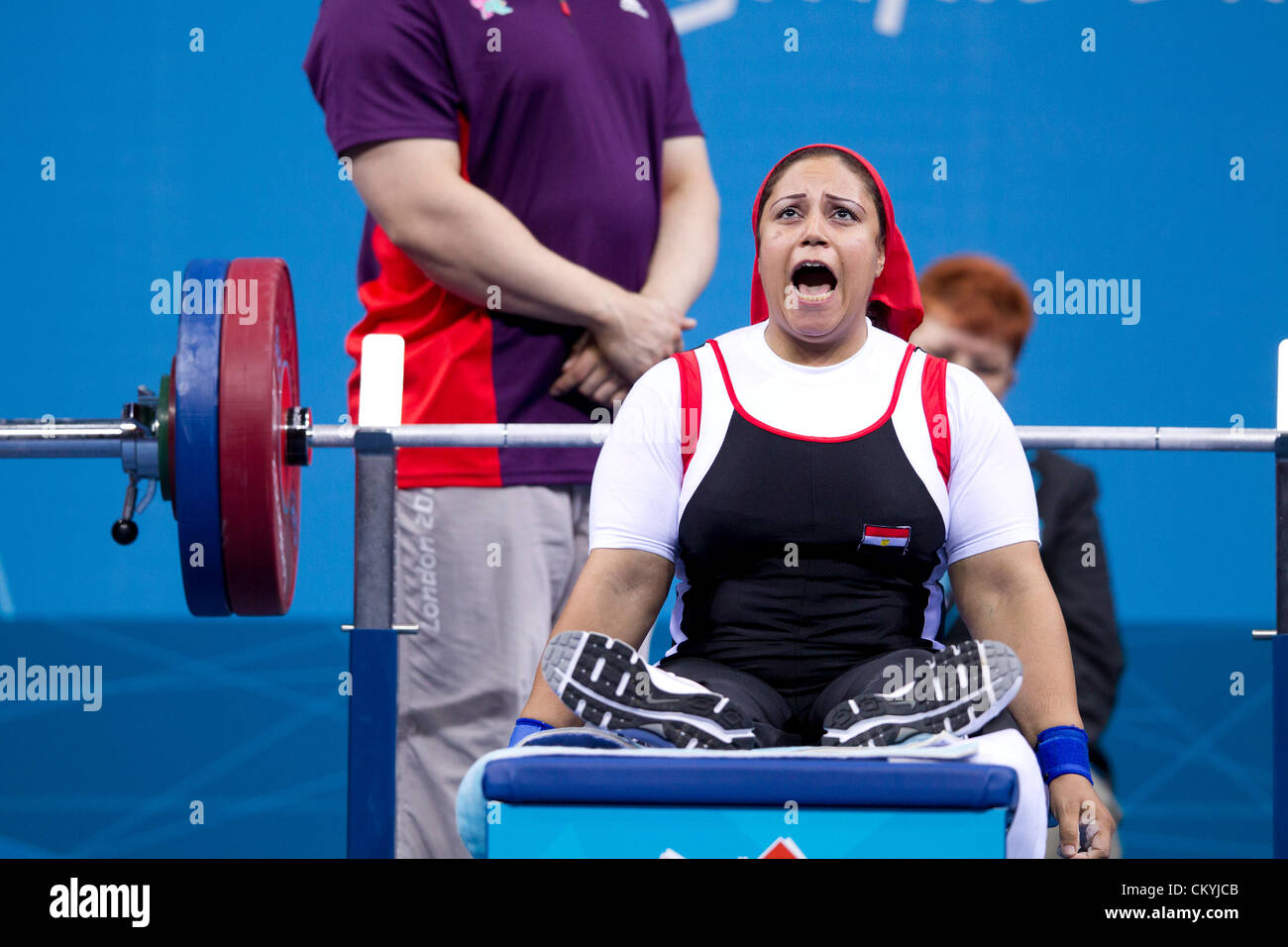 Egypt's Amany Ali lets out a yell before lifting in the women's 75kg powerlifting competition at the London Paralympics. Stock Photo