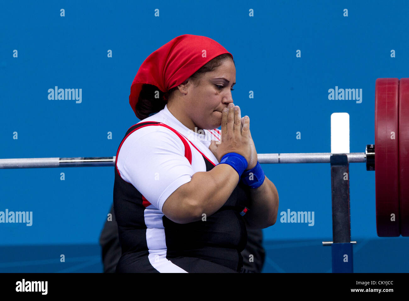 Egypt's Amany Ali appears to pray before lifting in the women's 75kg powerlifting competition at the London Paralympics. Stock Photo