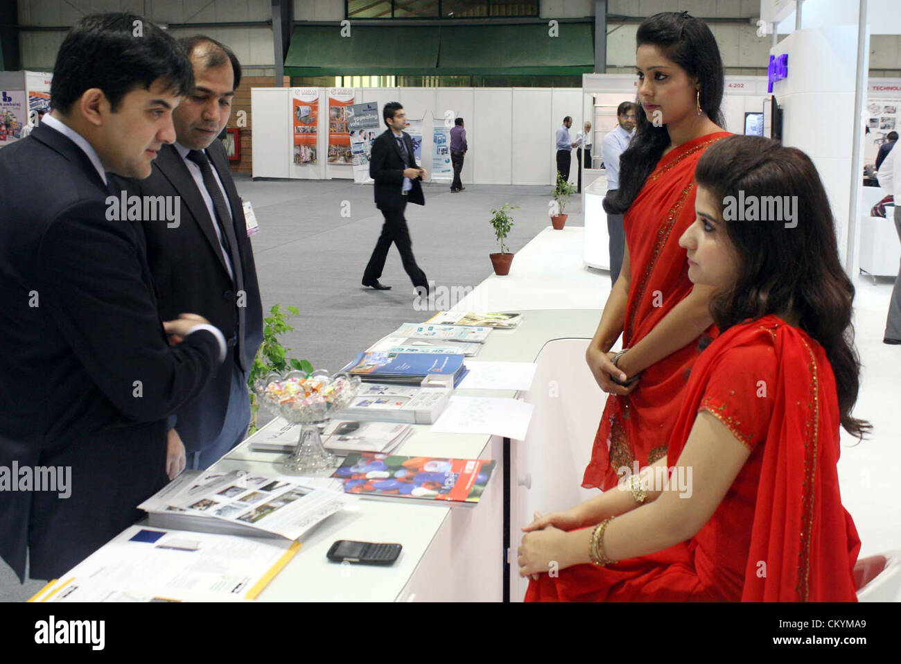 People visit a stall during Tenth Edition of International Plastic and Packing Industry