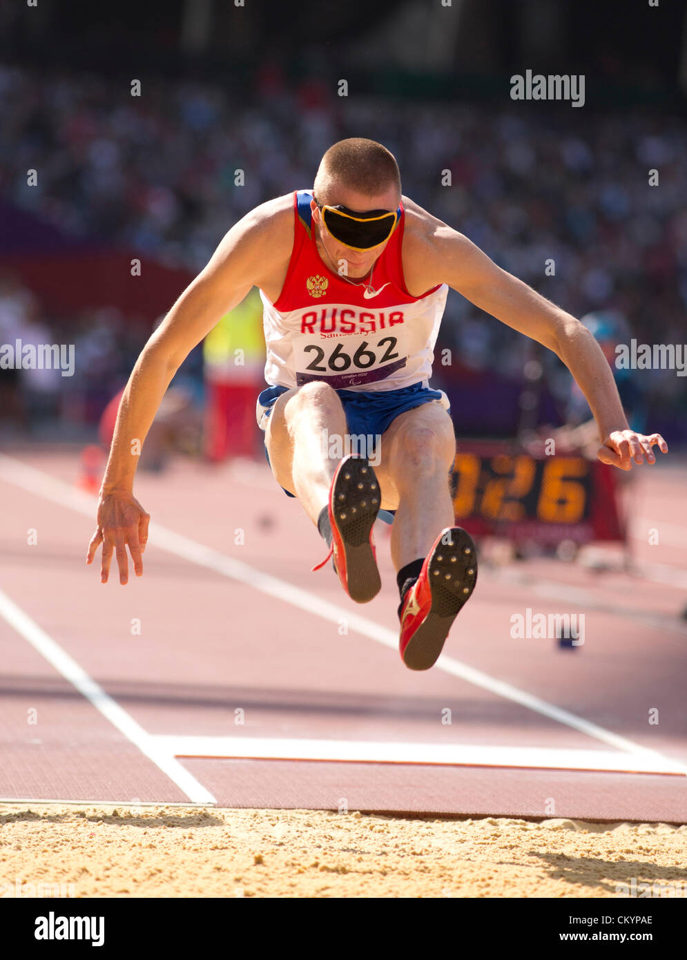 Blind long jumper Denis Gulen of Russia competes in the men's F11 long jump at the London Paralympic Games Stock Photo