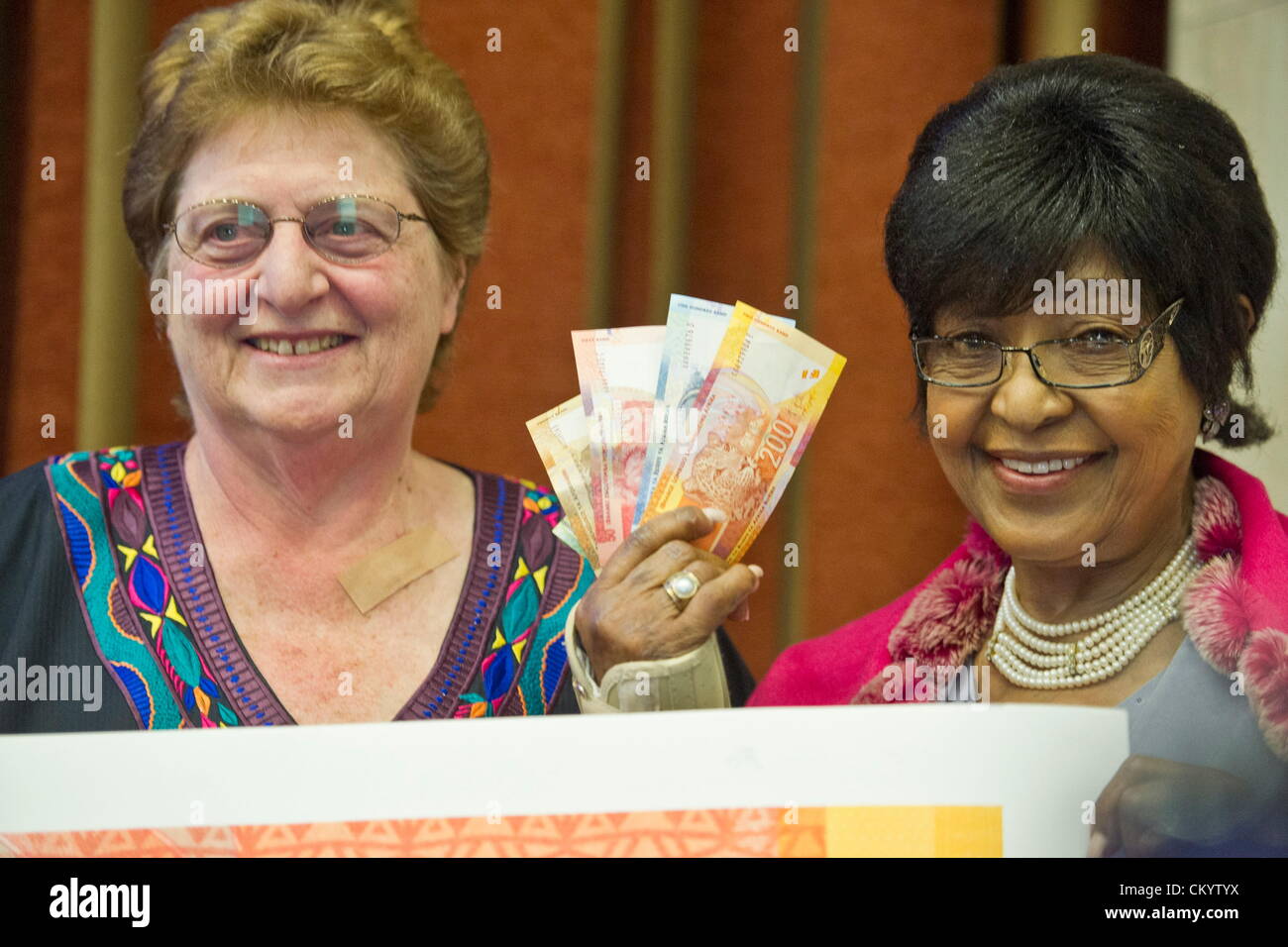 Pretoria, South Africa, 5th September 2012. Winnie Madikizela-Mandela and Reserve Bank Governor Gill Marcus during the launch of a national communication campaign to introduce a range of new banknotes honouring former President Nelson Mandela on September 5, 2012 in Pretoria, South Africa. The new notes will show Mandela’s face on the front and the Big Five on the back. (Photo by Gallo Images / Foto24 / Craig Nieuwenhuizen/Alamy Live News) Stock Photo
