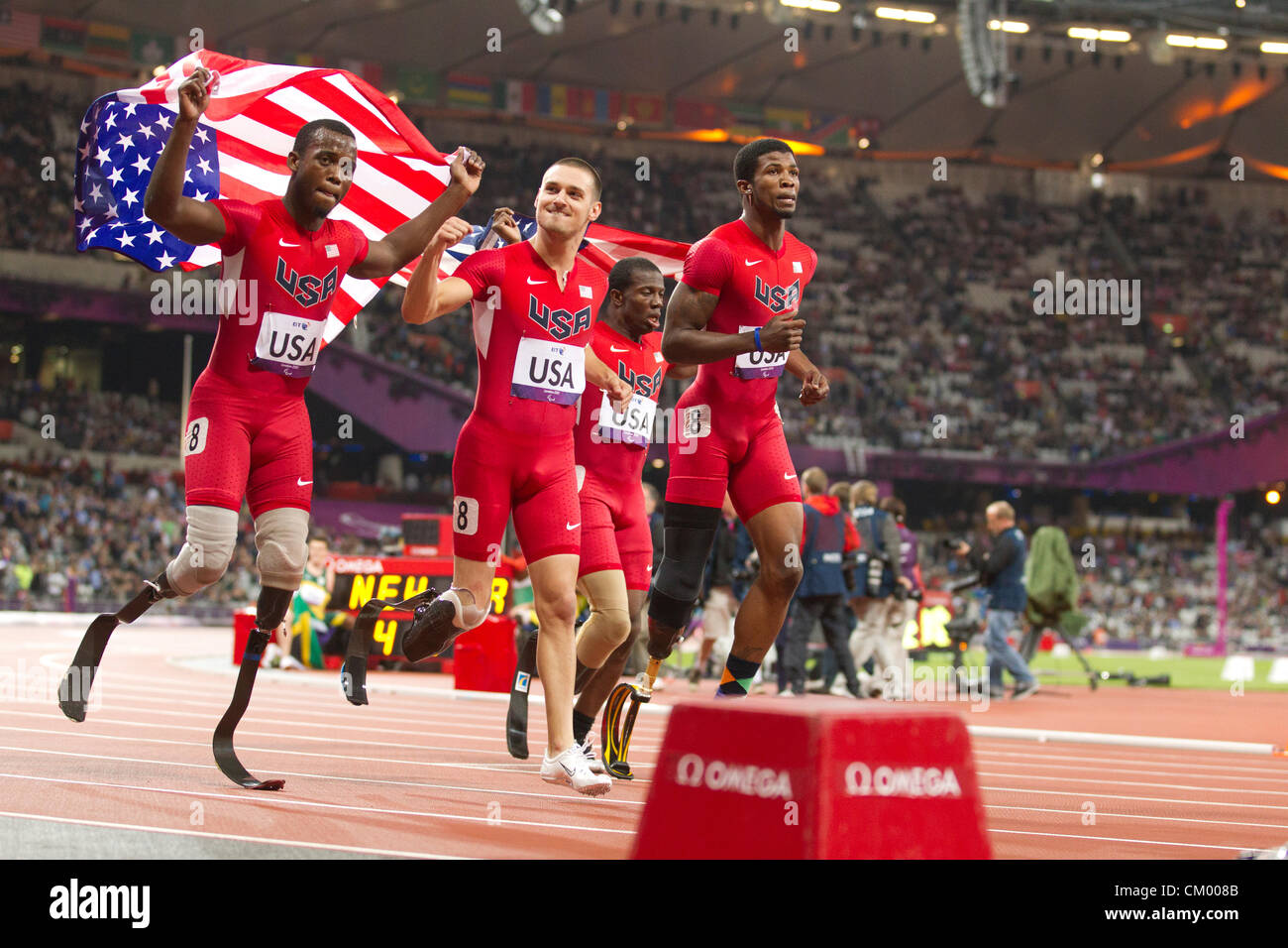 USA men's 4X100 meter T42-44  class relay team celebrates what the team thought was a medal finish at the Paralympics. Stock Photo