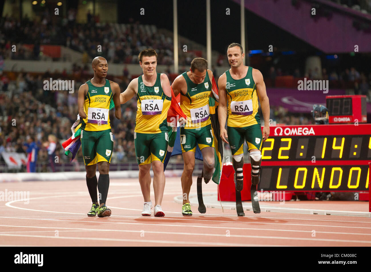 South Africa's men's 4X100 meter T42-44 relay team celebrates its world record and gold medal at the Paralympics in London. Stock Photo