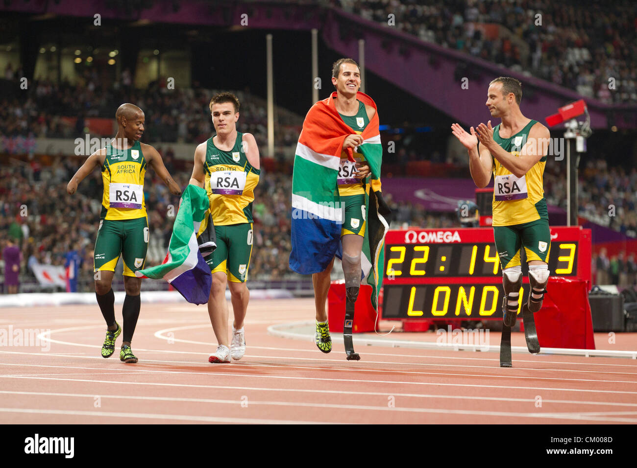 South Africa's men's 4X100 meter T42-44 relay team celebrates its world record and gold medal at the Paralympics in London. Stock Photo