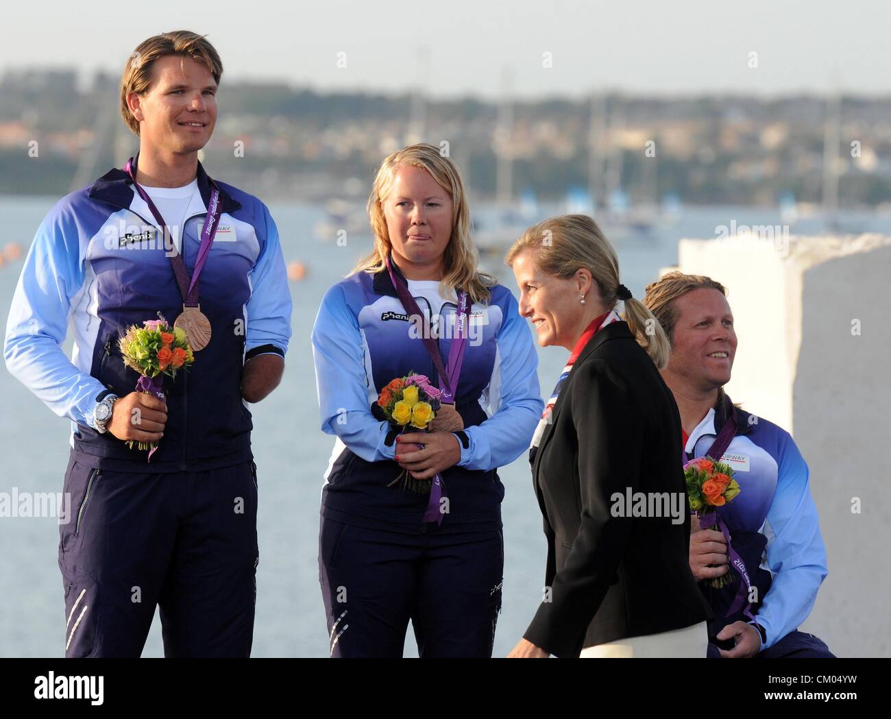 Catena Gentagen Konkurrencedygtige London 2012 Olympics: Sailing, medal ceremony Sophie, Countess of Wessex  presents Bronze to Aleksander Wang Hansen, Marie Solberg and Per Eugen  Kristiansen of Norway in the Three Person Keelboat or Sonar September