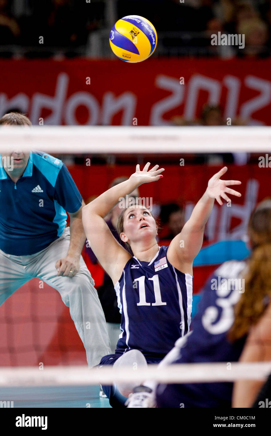 London, UK. 7th September 2012. 07.09.2012  London 2012 Sitting Volleyball Final Paralympic Games, from the ExCel Arena. Picture shows action from the gold medal contest U.S.A v China. No.11 Allison Miller (USA)  serves. Stock Photo