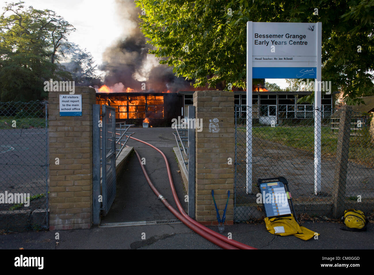 London 8th September 2012: A fire breaks out in the empty buildings of a former primary school called Bessemer Grange, off Denmark Hill in the south London borough of Southwark. The former pre-school structure was eventually gutted after six fire engines and 30 firefighters  of the London Fire Brigade arrived to douse the flames which had already taken hold of the prefabricated structure. Bessemer Grange junior school and the current nursery occupies a location across the road and is on the former site of Victorian iron magnate, Henry Bessemer's mansion. Credit:  RichardBaker / Alamy Live New Stock Photo