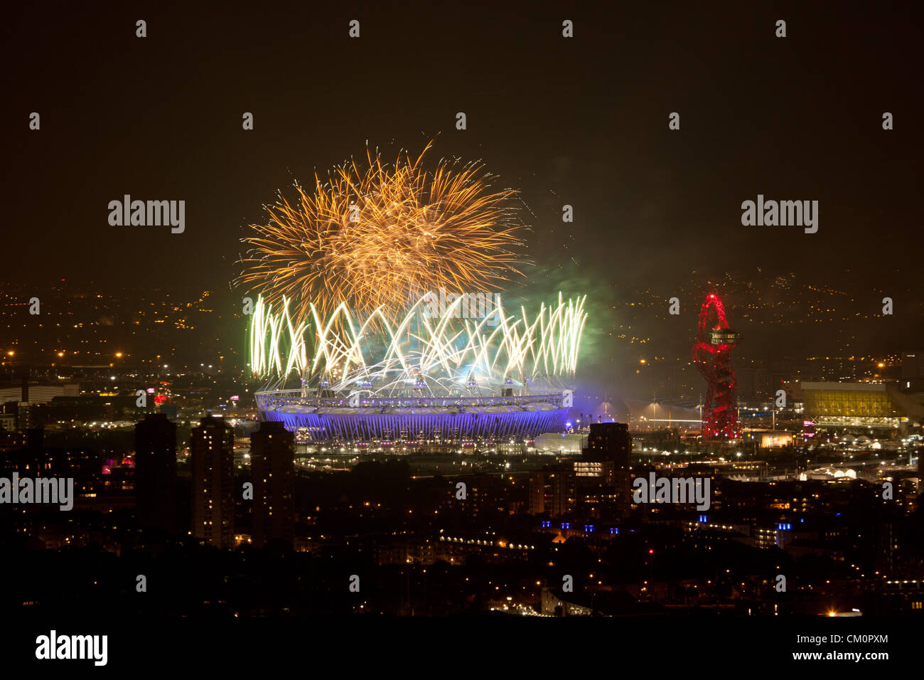LONDON, UK, 9th Sep, 2012. Fireworks light up the sky over the Olympic Stadium during the 2012 Paralympics closing ceremony, as seen from Canary Wharf, the financial centre in London's historic docklands. Stock Photo