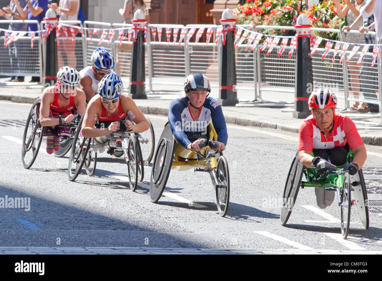 London, UK. 9th September 2012. Racing along Warwick lane near St. Pauls Cathedral in the City of London, right to left  Sandra Graf (Swiss, Gold Medal WInner), Shelly Woods (Team GB, Silver) , USA's Shirley Reilly (Gold Medal Winner), USA's Amanda McGrory (4th), unknown Stock Photo