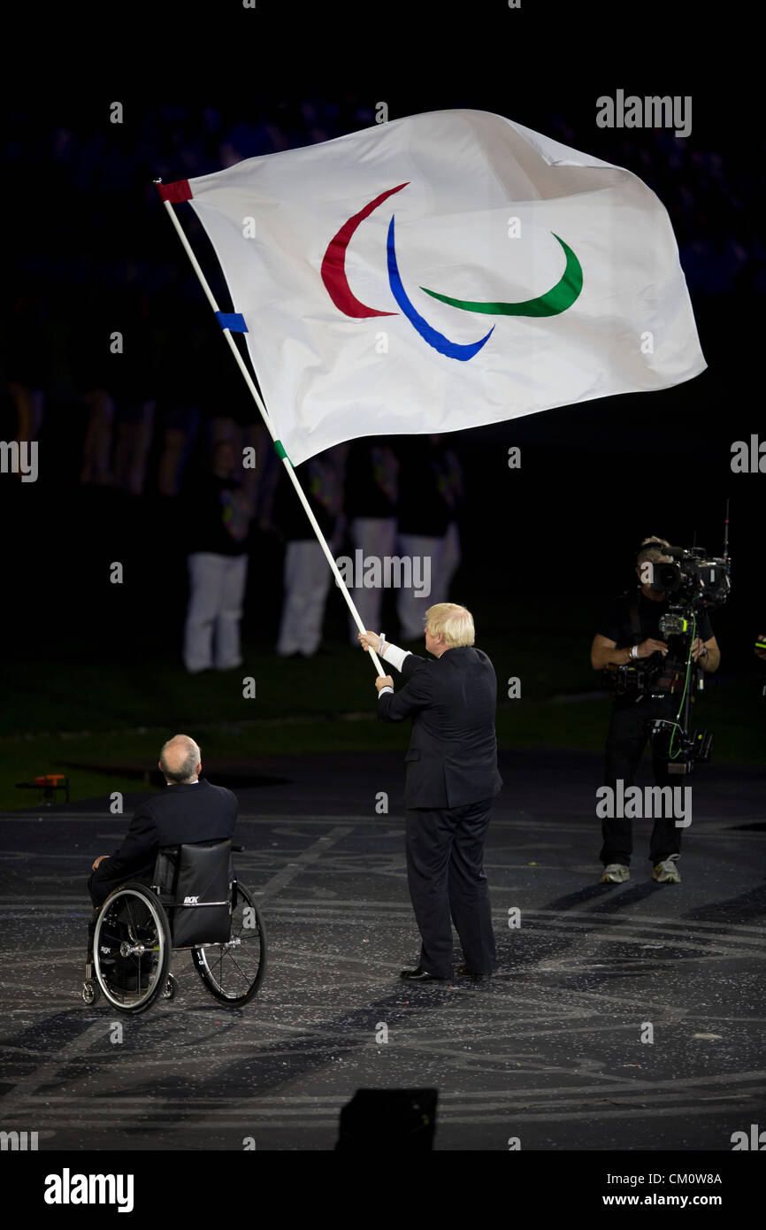 London Mayor Boris Johnson waves the Paralympic flag at the closing ceremonies of the 2012 London Paralympic Games. Stock Photo