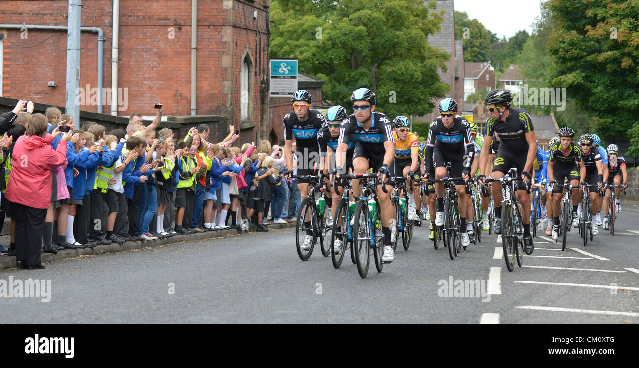 Knutsford, Cheshire, UK. 10th September 2012. Team Sky with Bradley Wigging fifth from left and Race Leader Luke Rowe in yellow enters Knutsford, Cheshire on the second stage from Nottingham to Knowsley Safari Park in the 2012 Tour of Britain.The race has 100 riders from 21 different countries in 17 teams. Credit:  John Fryer / Alamy Live News Stock Photo