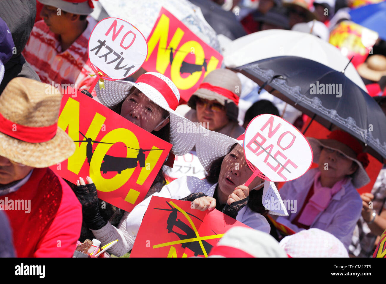 September 9, 2012, Okinawa, Japan - Demonstrators hold placards during ...