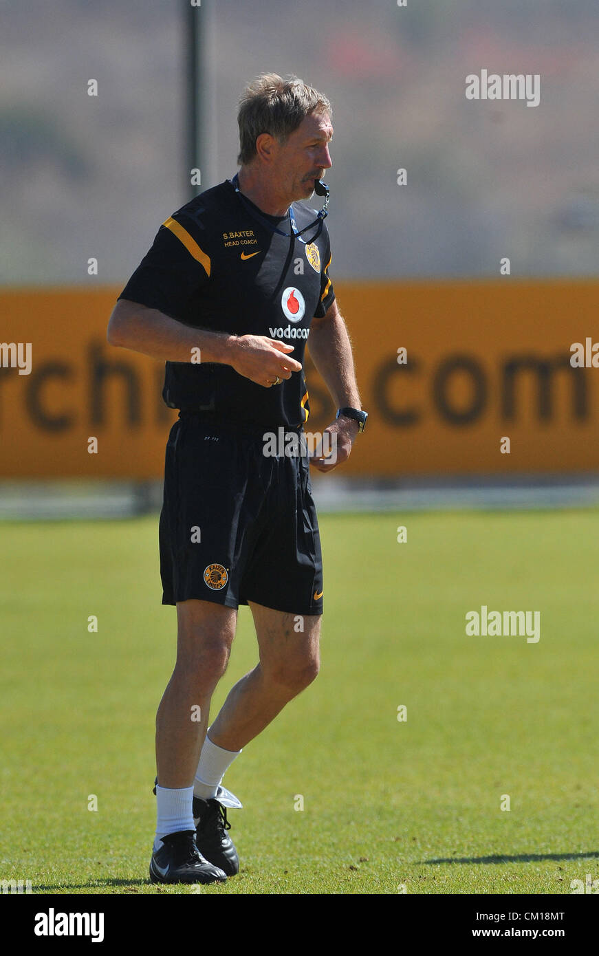 JOHANNESBURG, SOUTH AFRICA - SEPTEMBER 12, Stuart Baxter blows his ...