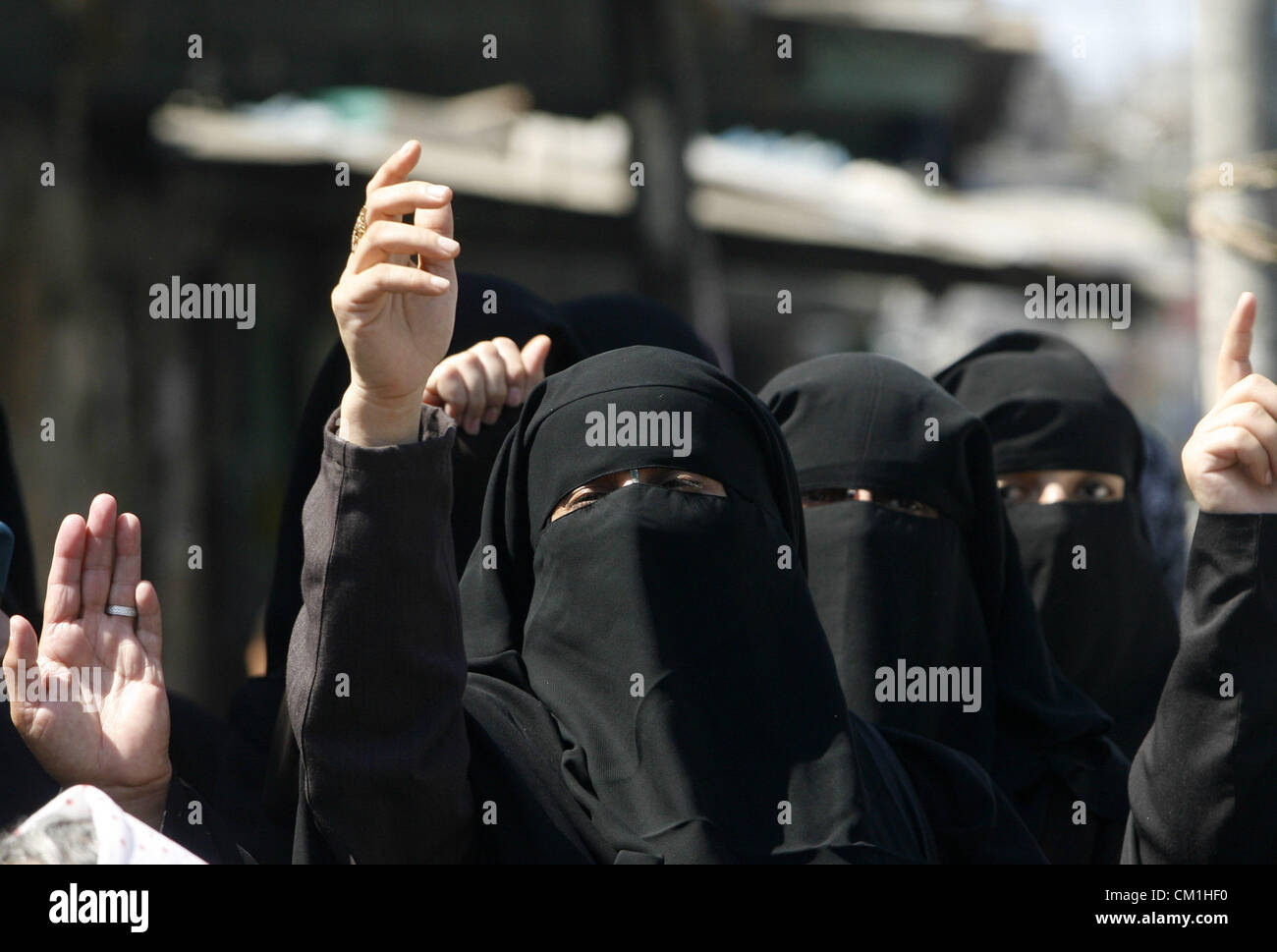 Sept. 14, 2012 - Rafah, Gaza Strip, Palestinian Territory - Palestinian women shout anti-US slogans during a demonstration against the controversial film 'Innocence of Muslims' in Rafah southern Gaza strip, on September 14, 2012. The controversial low budget film reportedly made by an Israeli-American which portrays Muslims as immoral and gratuitous, sparked fury in Libya, where four Americans including the ambassador were killed on Tuesday when a mob attacked the US consulate in Benghazi, and has led to protests outside US missions in Morocco, Sudan, Egypt, Tunisia and Yemen  (Credit Image: © Stock Photo