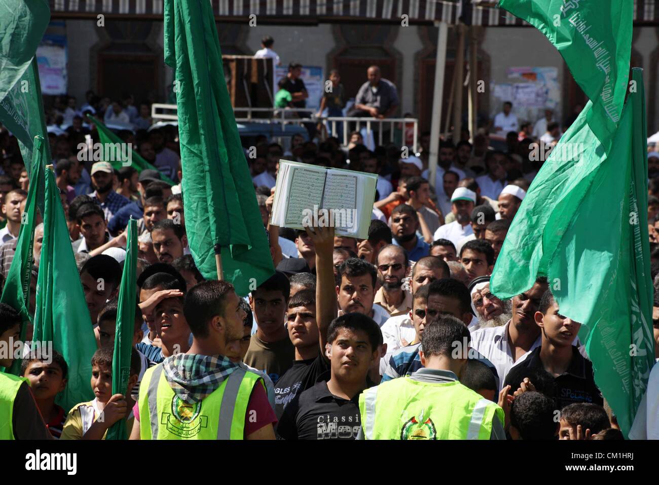 Sept. 14, 2012 - Gaza City, Gaza Strip, Palestinian Territory - Palestinians hold placards as they shout anti-U.S. slogans during a demonstration against the controversial film 'Innocence of Muslims' in Khan Younis southern Gaza strip, on September 14, 2012. The controversial low budget film reportedly made by an Israeli-American which portrays Muslims as immoral and gratuitous, sparked fury in Libya, where four Americans including the ambassador were killed on Tuesday when a mob attacked the US consulate in Benghazi, and has led to protests outside US missions in Morocco, Sudan, Egypt, Tunisi Stock Photo