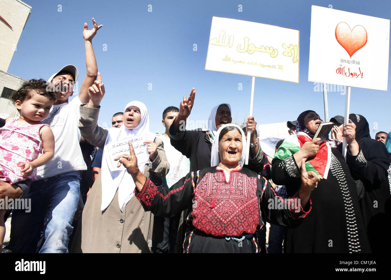 Sept. 14, 2012 - Jerusalem, Jerusalem, Palestinian Territory - Palestinians shout slogans during a demonstration against the controversial film 'Innocence of Muslims' in front of al-Aqsa Mosqe in Jerusalem, on September 14, 2012. The controversial low budget film reportedly made by an Israeli-American which portrays Muslims as immoral and gratuitous, sparked fury in Libya, where four Americans including the ambassador were killed on Tuesday when a mob attacked the US consulate in Benghazi, and has led to protests outside US missions in Morocco, Sudan, Egypt, Tunisia and Yemen  (Credit Image: © Stock Photo