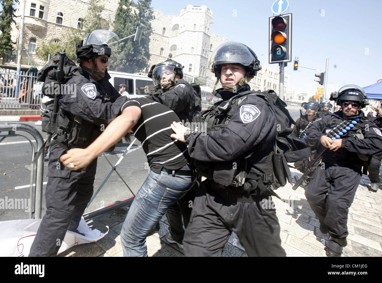 Sept. 14, 2012 - Jerusalem, Jerusalem, Palestinian Territory - Israeli policemen detain a Palestinian protester during a demonstration against the controversial film 'Innocence of Muslims' in front of al-Aqsa Mosqe in Jerusalem, on September 14, 2012. The controversial low budget film reportedly made by an Israeli-American which portrays Muslims as immoral and gratuitous, sparked fury in Libya, where four Americans including the ambassador were killed on Tuesday when a mob attacked the US consulate in Benghazi, and has led to protests outside US missions in Morocco, Sudan, Egypt, Tunisia and Y Stock Photo