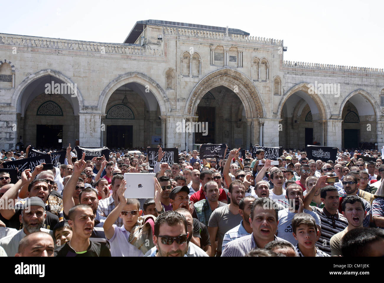 Sept. 14, 2012 - Jerusalem, Jerusalem, Palestinian Territory - Palestinians shout slogans during a demonstration against the controversial film 'Innocence of Muslims' in front of al-Aqsa Mosqe in Jerusalem, on September 14, 2012. The controversial low budget film reportedly made by an Israeli-American which portrays Muslims as immoral and gratuitous, sparked fury in Libya, where four Americans including the ambassador were killed on Tuesday when a mob attacked the US consulate in Benghazi, and has led to protests outside US missions in Morocco, Sudan, Egypt, Tunisia and Yemen  (Credit Image: © Stock Photo