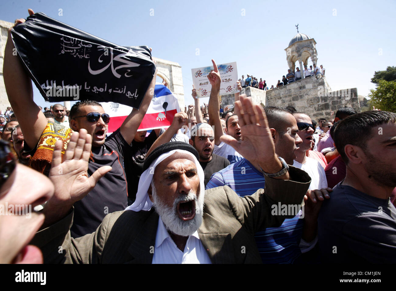 Sept. 14, 2012 - Jerusalem, Jerusalem, Palestinian Territory - Palestinians shout slogans during a demonstration against the controversial film 'Innocence of Muslims' in front of al-Aqsa Mosqe in Jerusalem, on September 14, 2012. The controversial low budget film reportedly made by an Israeli-American which portrays Muslims as immoral and gratuitous, sparked fury in Libya, where four Americans including the ambassador were killed on Tuesday when a mob attacked the US consulate in Benghazi, and has led to protests outside US missions in Morocco, Sudan, Egypt, Tunisia and Yemen  (Credit Image: © Stock Photo